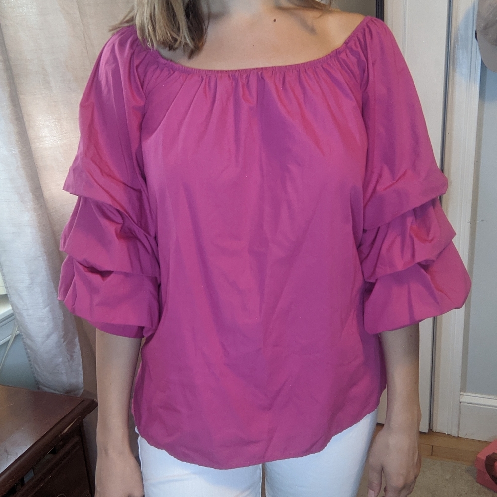 Hot pink blouse with big ruffled sleeves